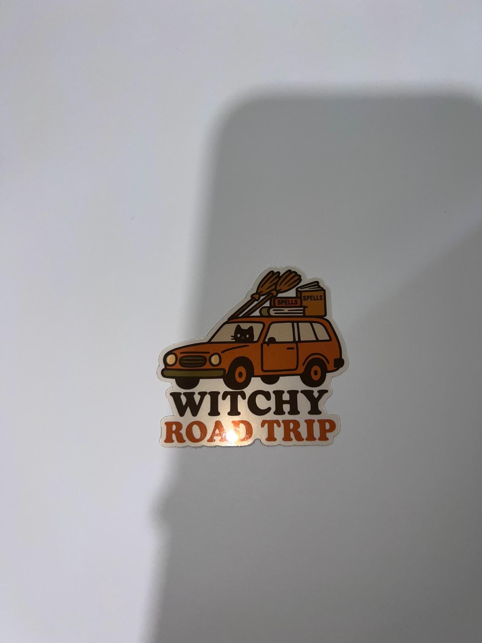 Witchy Road Trip Sticker – Spooky Car Packed with Brooms & Black Cats